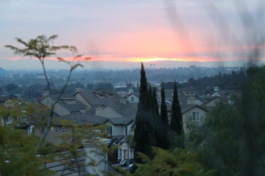 A view of a city from a window

Description automatically generated
