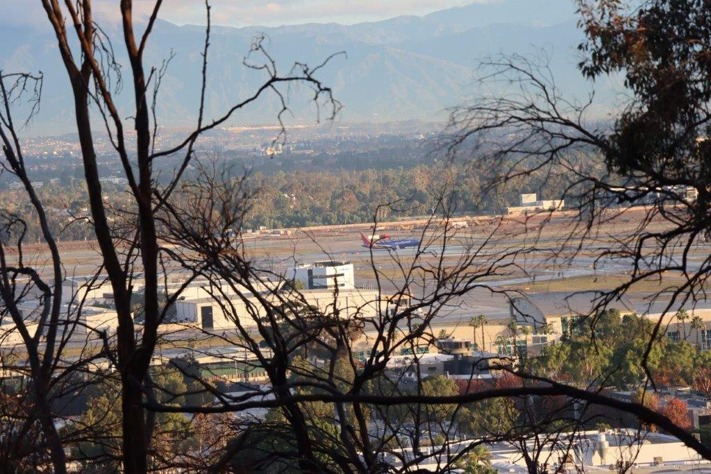 A view of a city from a hill

Description automatically generated