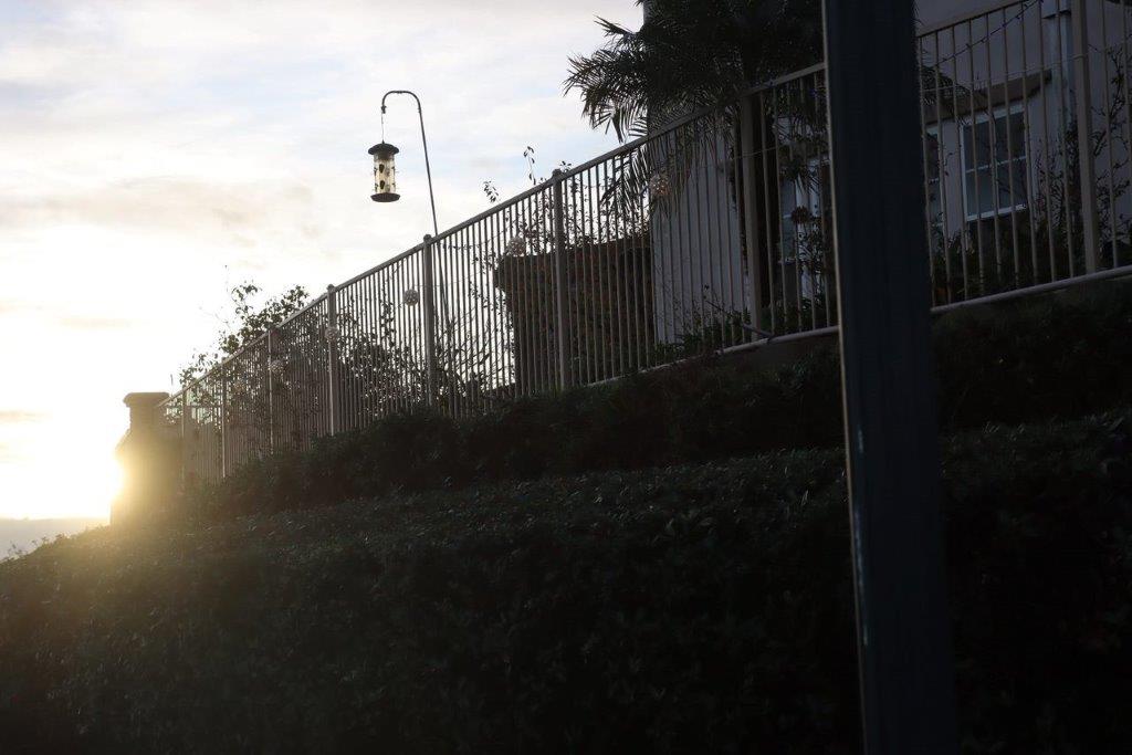 A fence and a lamp post

Description automatically generated