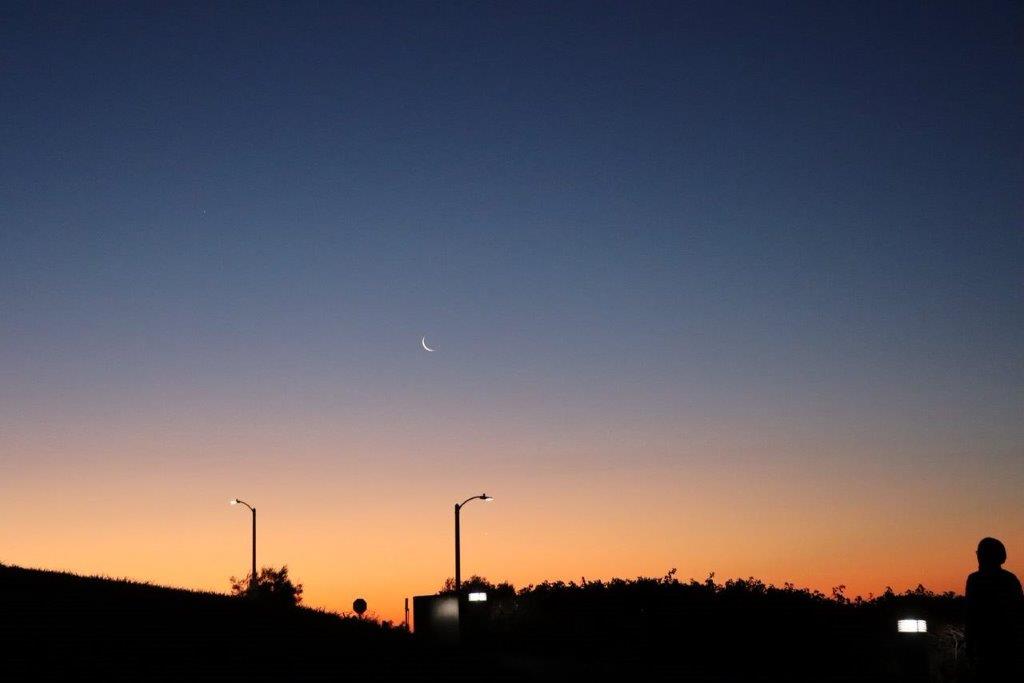 A moon in the sky

Description automatically generated