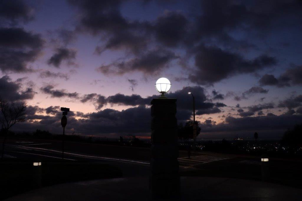 A light on a pillar at night

Description automatically generated