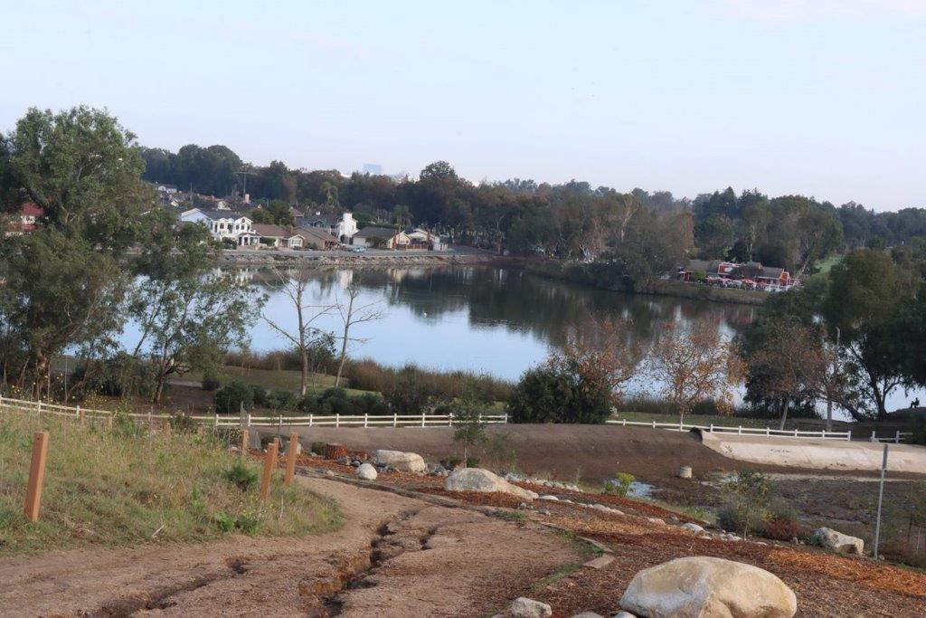 A lake with a body of water

Description automatically generated