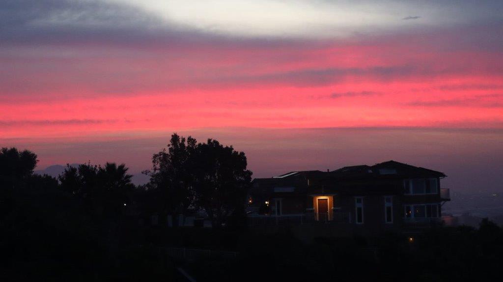 A house with a pink sky

Description automatically generated