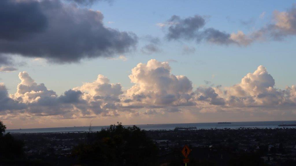 A cloudy sky over a city

Description automatically generated