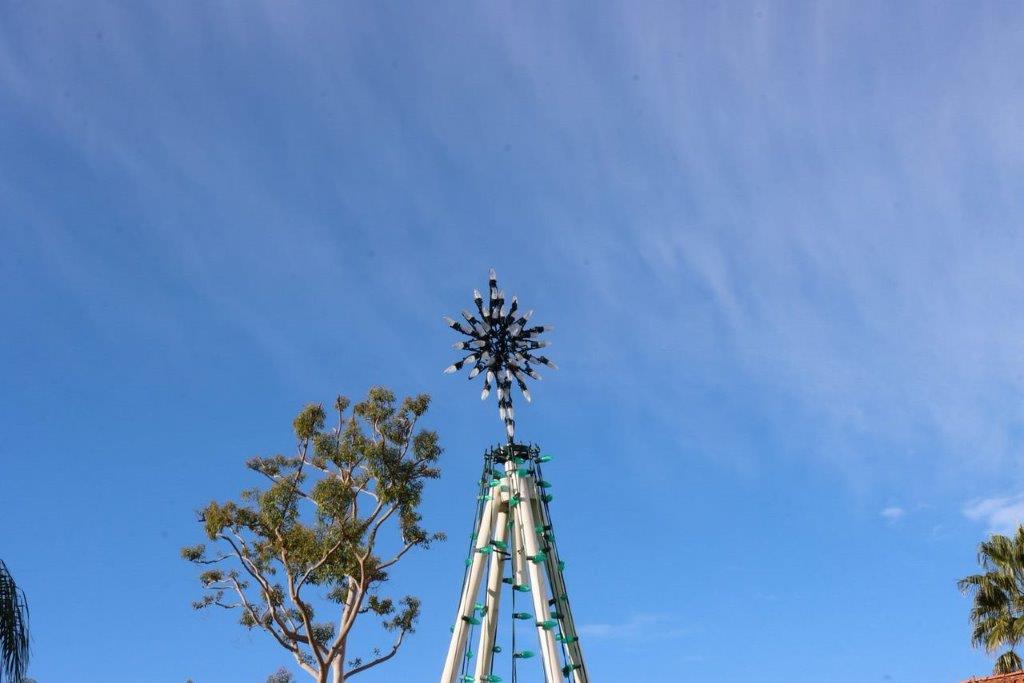 A tall structure with a star on top

Description automatically generated