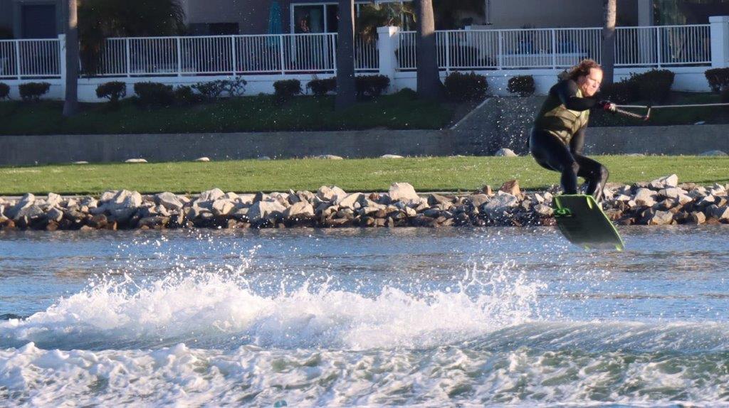 A person riding a wakeboard

Description automatically generated