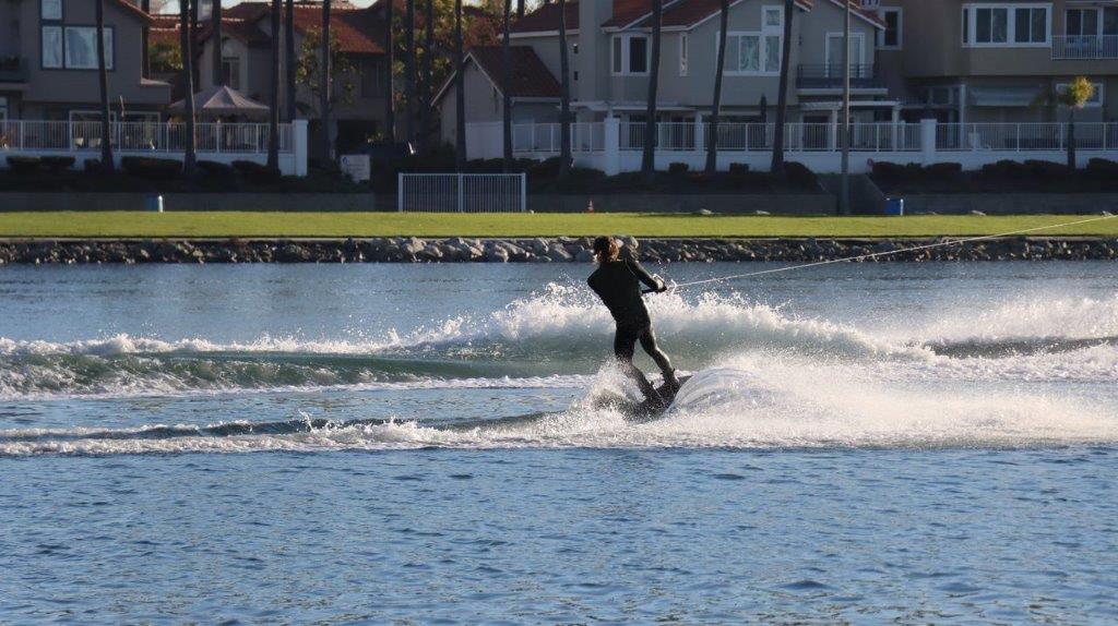 A person on a surfboard

Description automatically generated