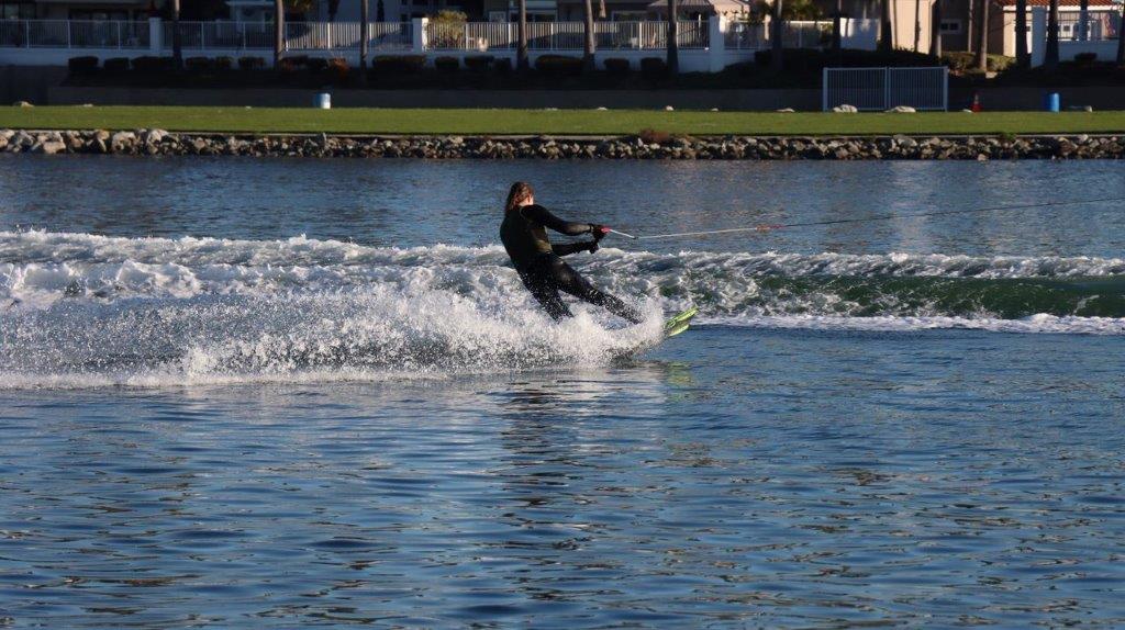 A person water skiing on the water

Description automatically generated