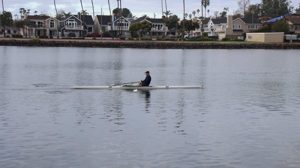 A person in a boat on the water

Description automatically generated