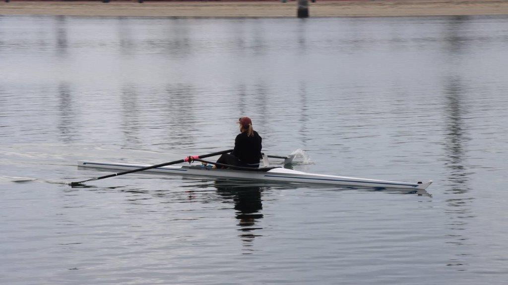 A person in a boat on the water

Description automatically generated