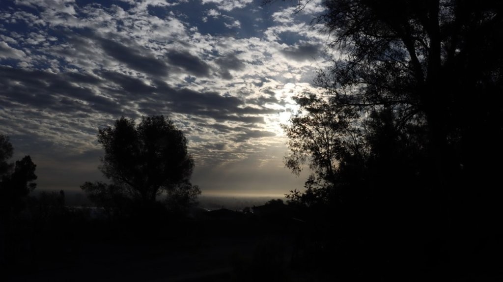A silhouette of trees and clouds

AI-generated content may be incorrect.