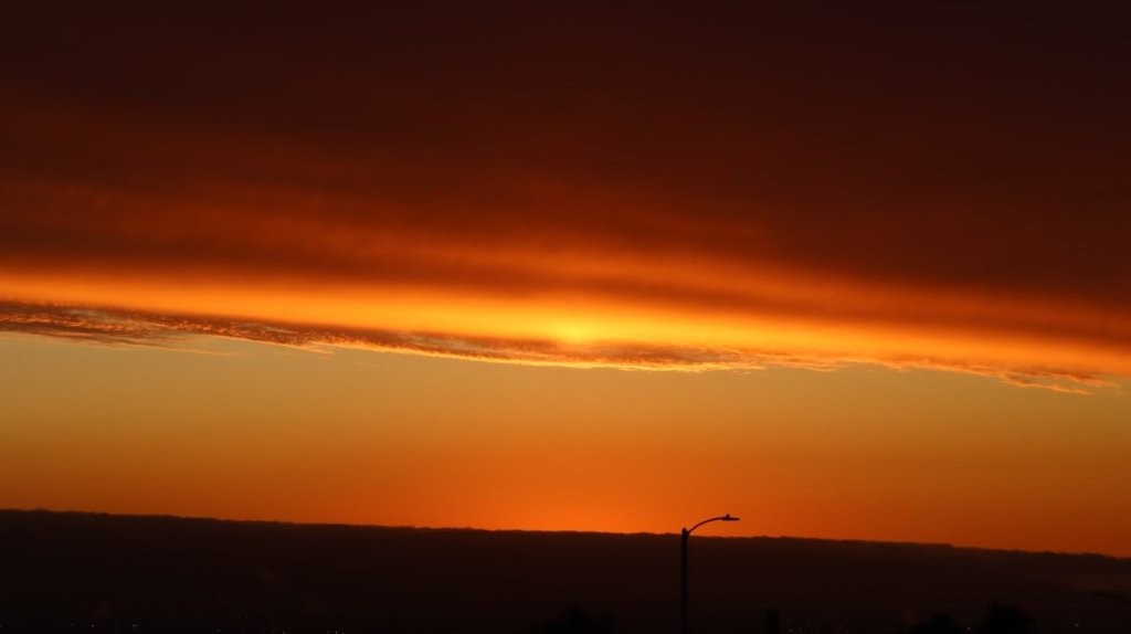 A sunset with clouds in the sky

AI-generated content may be incorrect.
