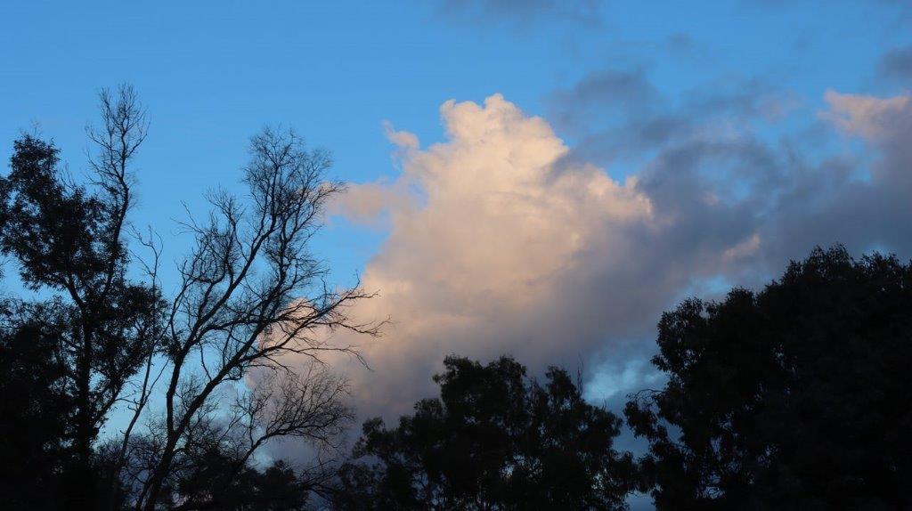 A white cloud in the sky

Description automatically generated