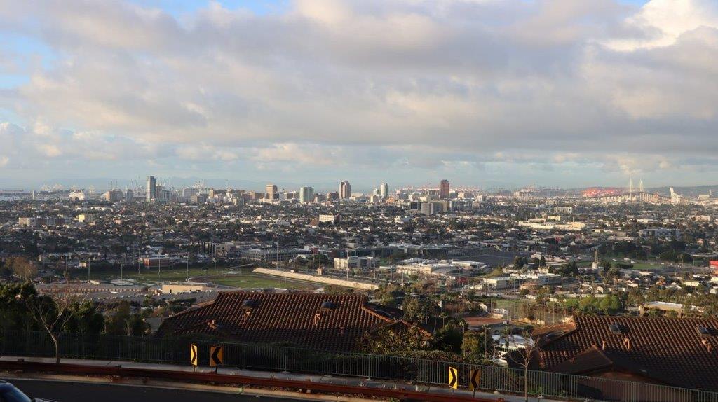 A cityscape with a road and buildings

Description automatically generated