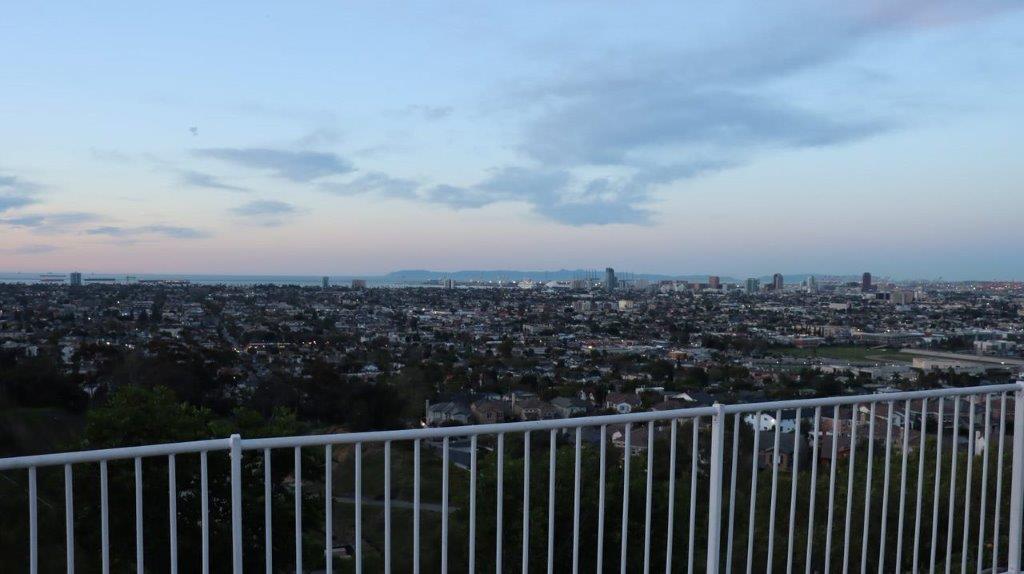 A view of a city from a balcony

Description automatically generated