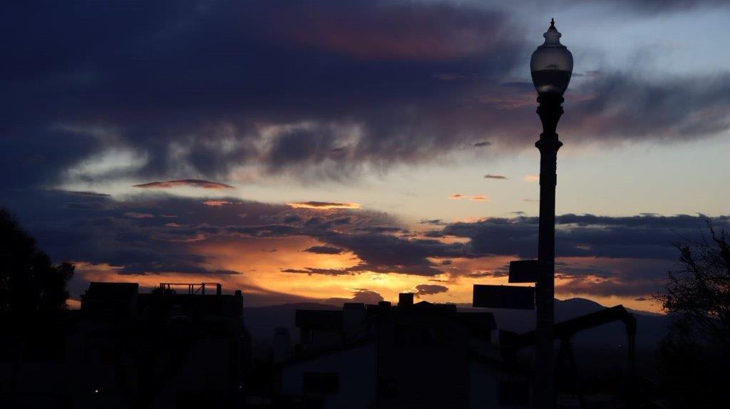 A street light and a sunset

Description automatically generated