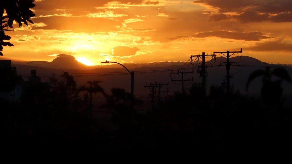 A sunset over a city

Description automatically generated with medium confidence