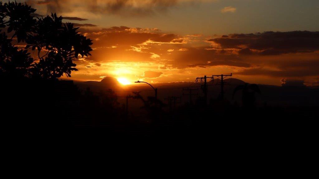 A sunset over a city

Description automatically generated with medium confidence