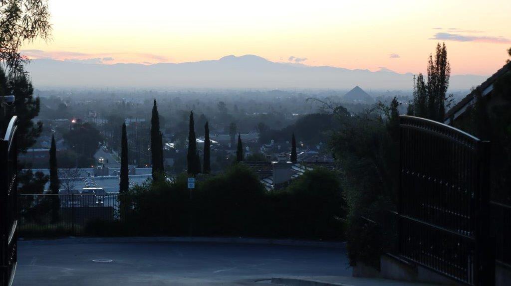 A view of a city from a hill

Description automatically generated