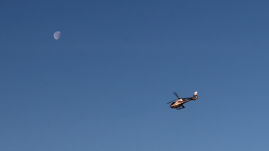 A helicopter flying in the sky

AI-generated content may be incorrect.