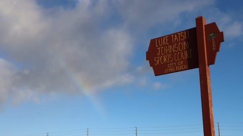A brown sign with gold writing

Description automatically generated
