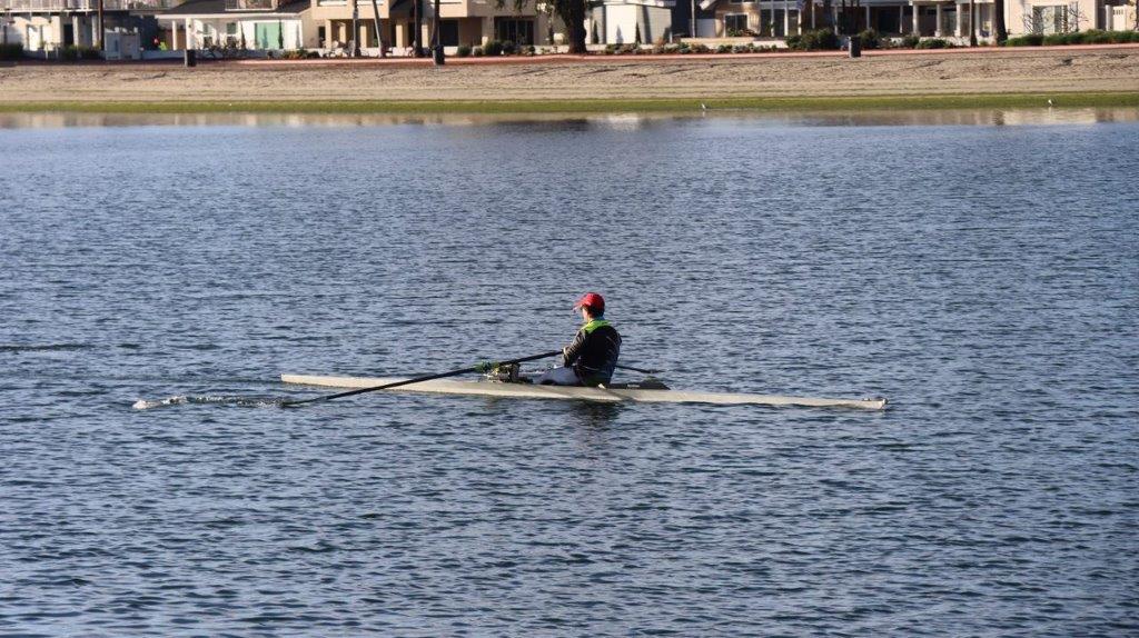 A person in a boat on the water

Description automatically generated