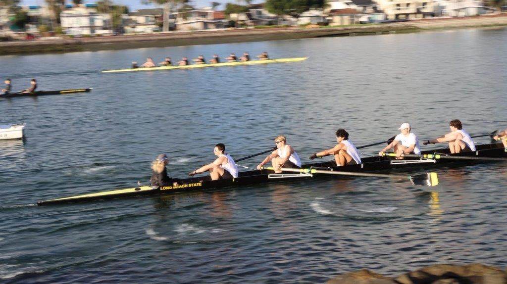 A group of people rowing on a river

Description automatically generated