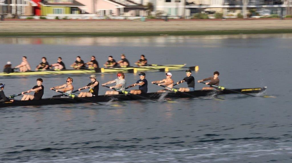 A group of people rowing on a river

Description automatically generated