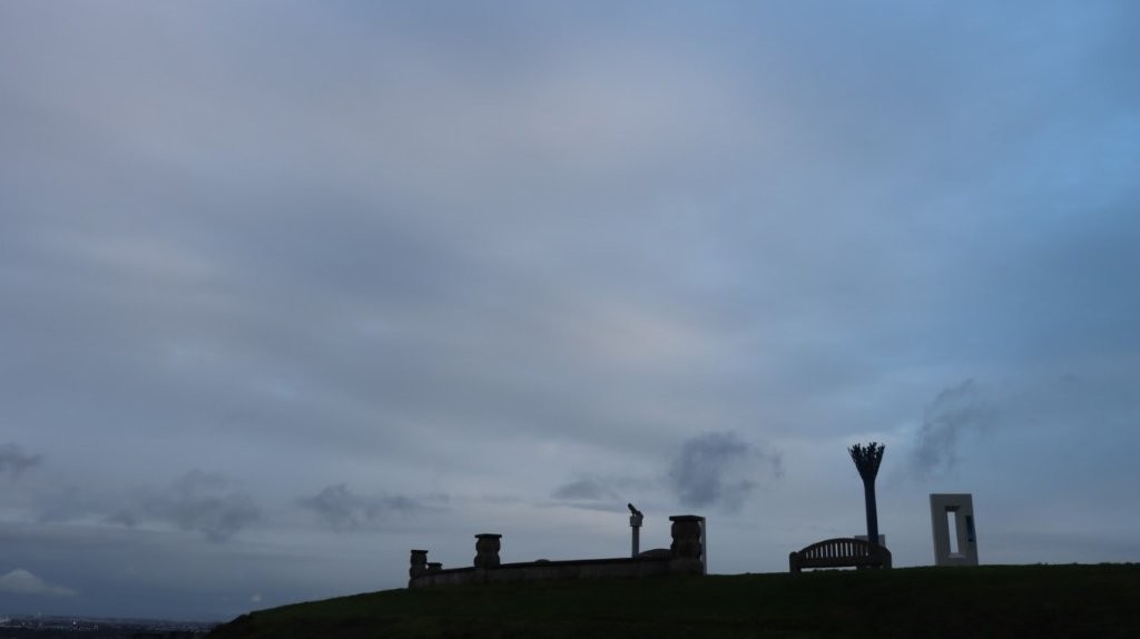 A cloudy sky over a hill

AI-generated content may be incorrect.