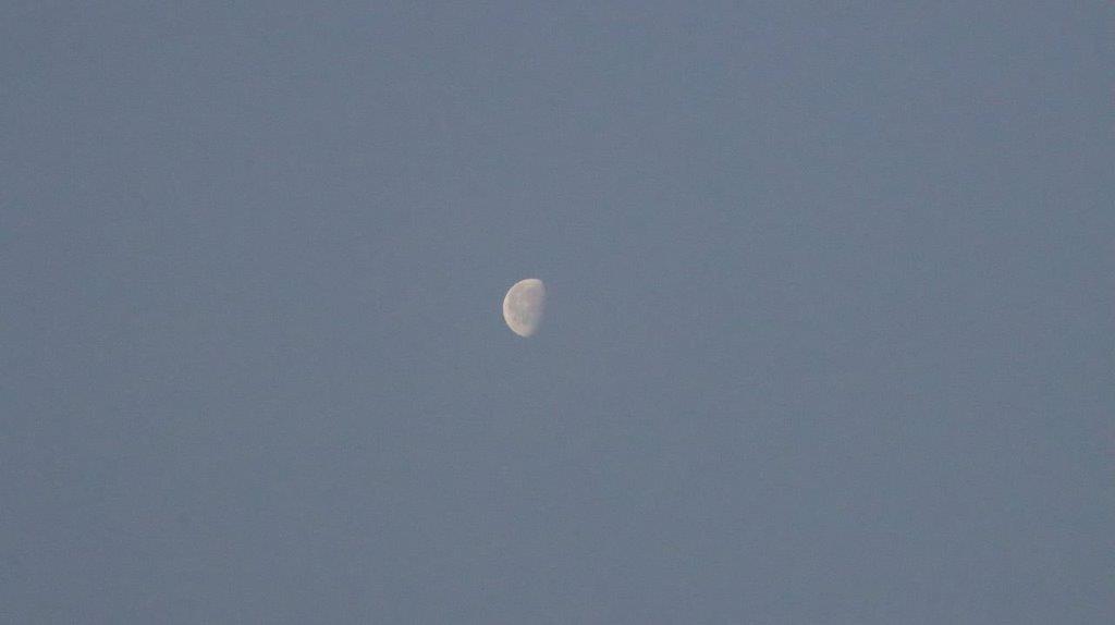 A moon in the sky

Description automatically generated