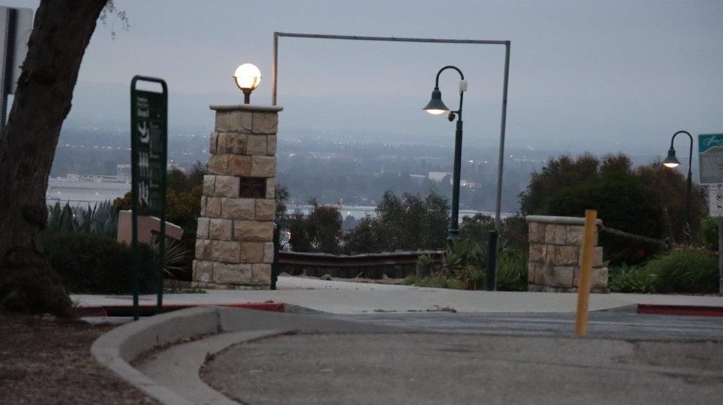 A light post and a pole

Description automatically generated with medium confidence