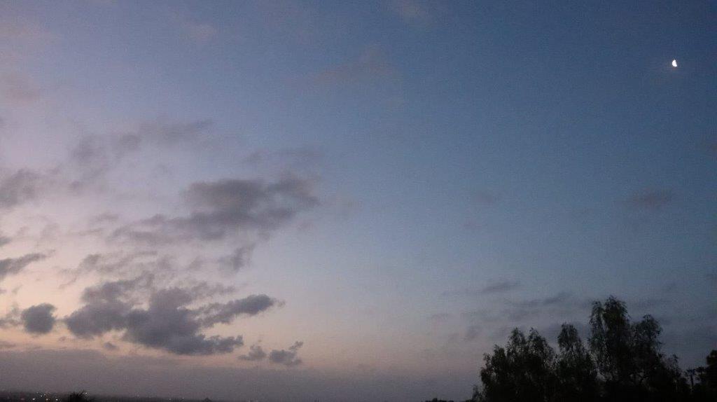 A blue sky with clouds

Description automatically generated