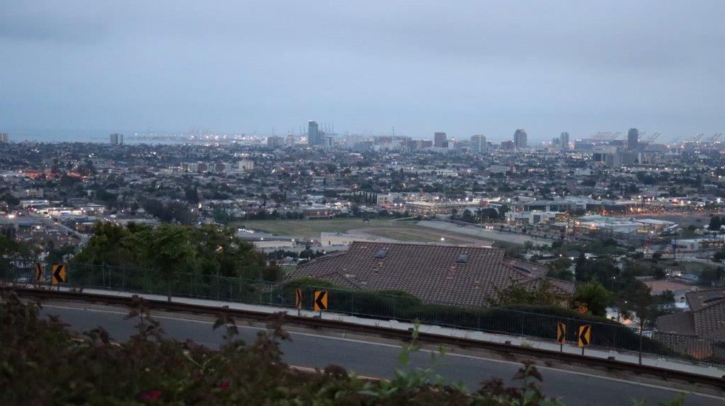 A view of a city from a hill

Description automatically generated