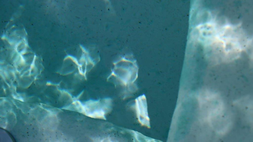 A close-up of a blue surface

Description automatically generated
