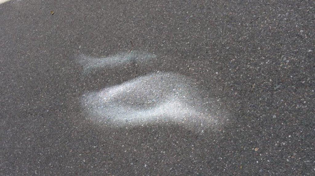 A white spot on the pavement

Description automatically generated