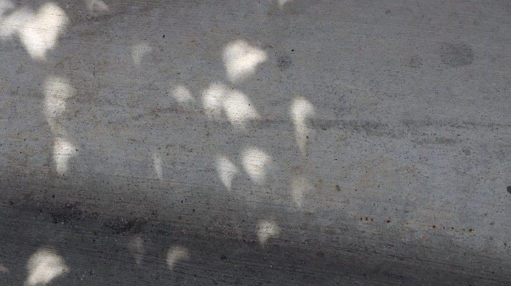 A close-up of a concrete surface

Description automatically generated