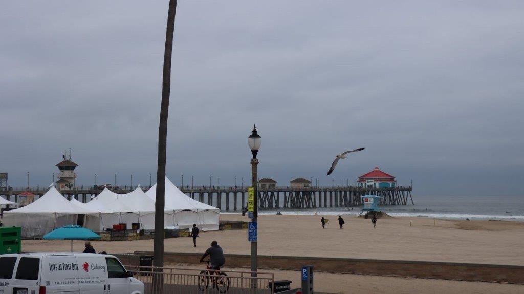 A beach with a pier and a pier

Description automatically generated