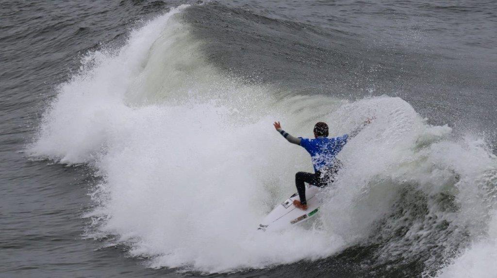 A person surfing on a wave

Description automatically generated