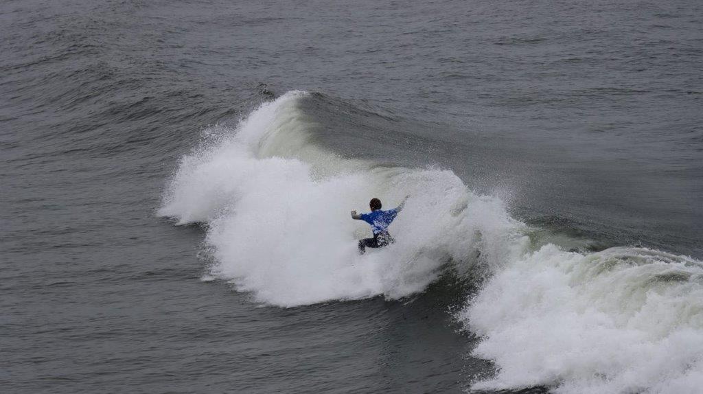 A person surfing on a wave

Description automatically generated