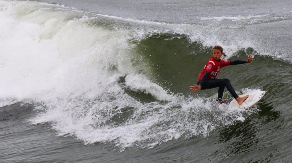 A person surfing on a wave

Description automatically generated