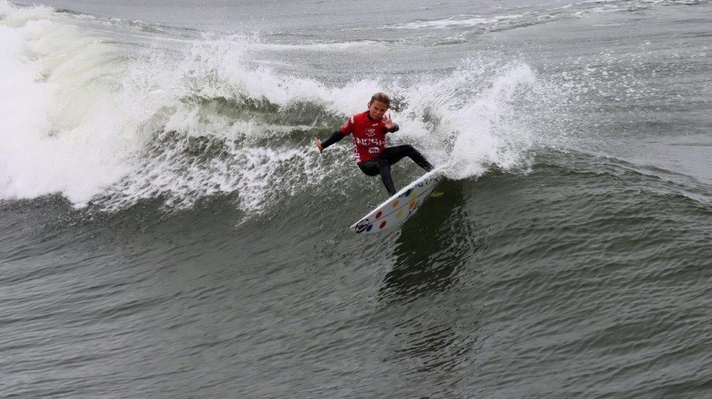 A person surfing on a wave

Description automatically generated