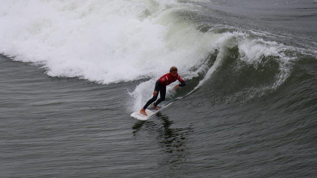 A person surfing on a wave

Description automatically generated