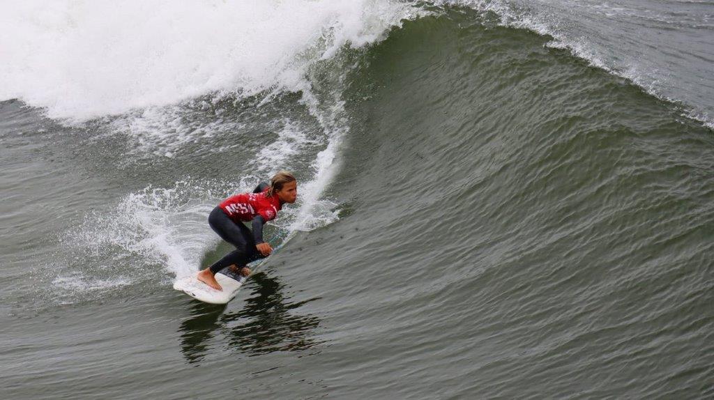 A person surfing on a wave

Description automatically generated