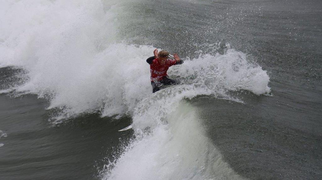 A person surfing on a wave

Description automatically generated