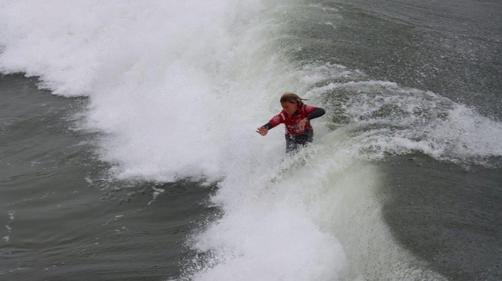 A person surfing on a wave

Description automatically generated