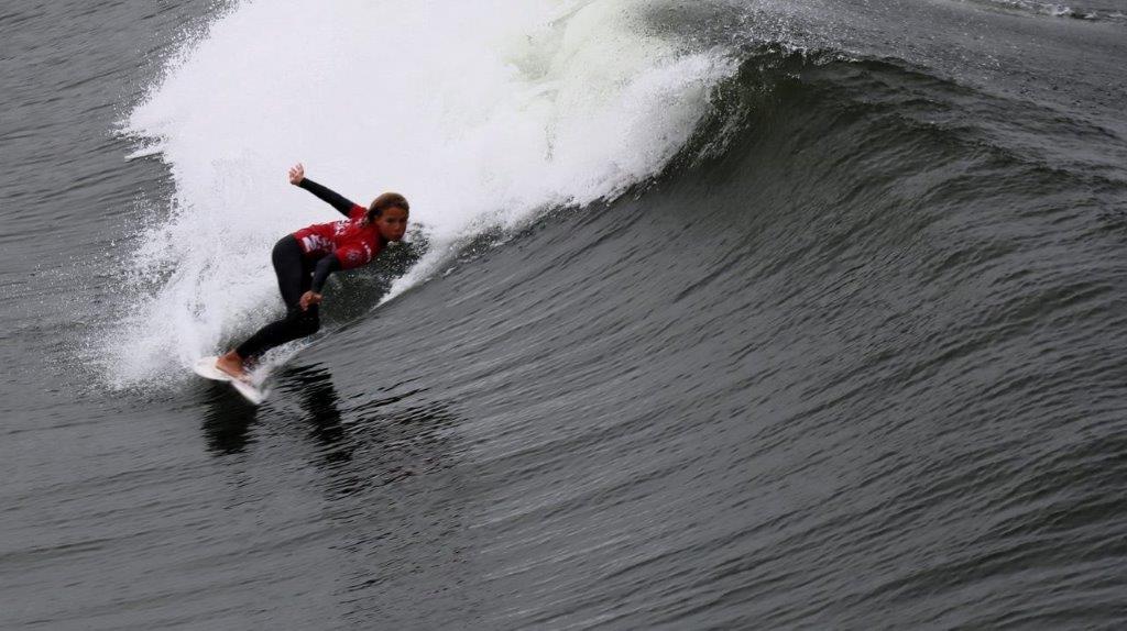 A person surfing on a wave

Description automatically generated