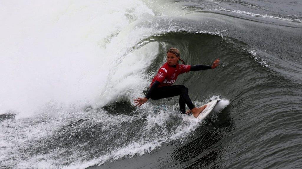 A person surfing on a wave

Description automatically generated