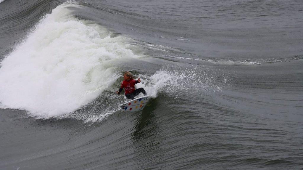 A person surfing on a wave

Description automatically generated
