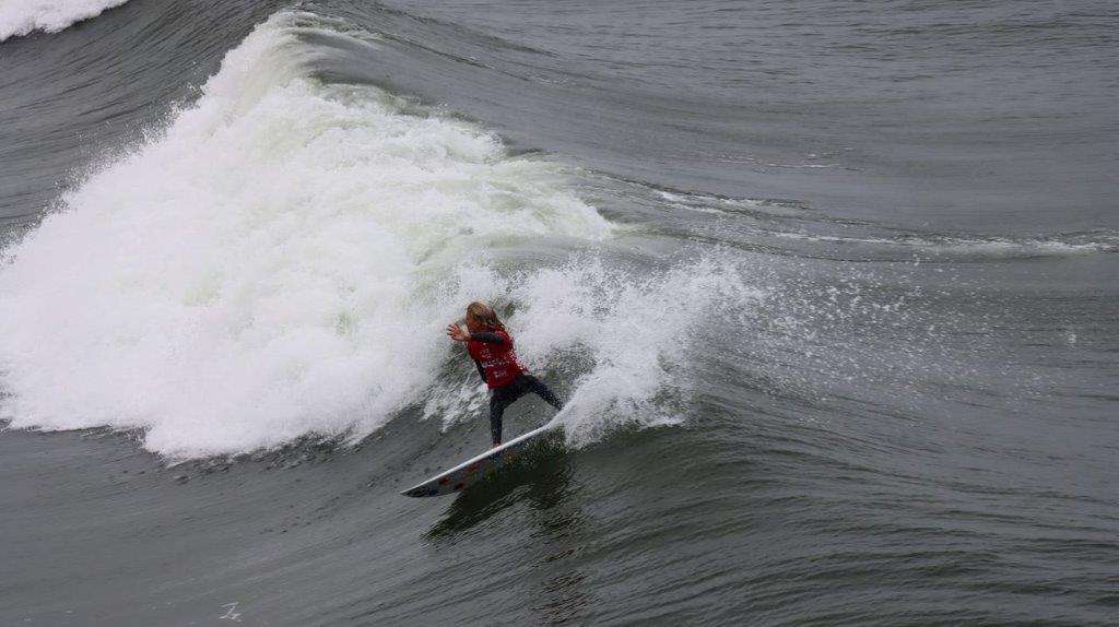 A person surfing on a wave

Description automatically generated