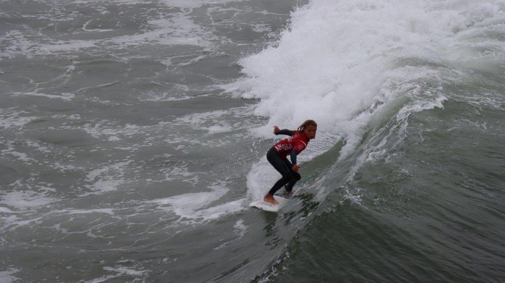 A person surfing on a wave

Description automatically generated